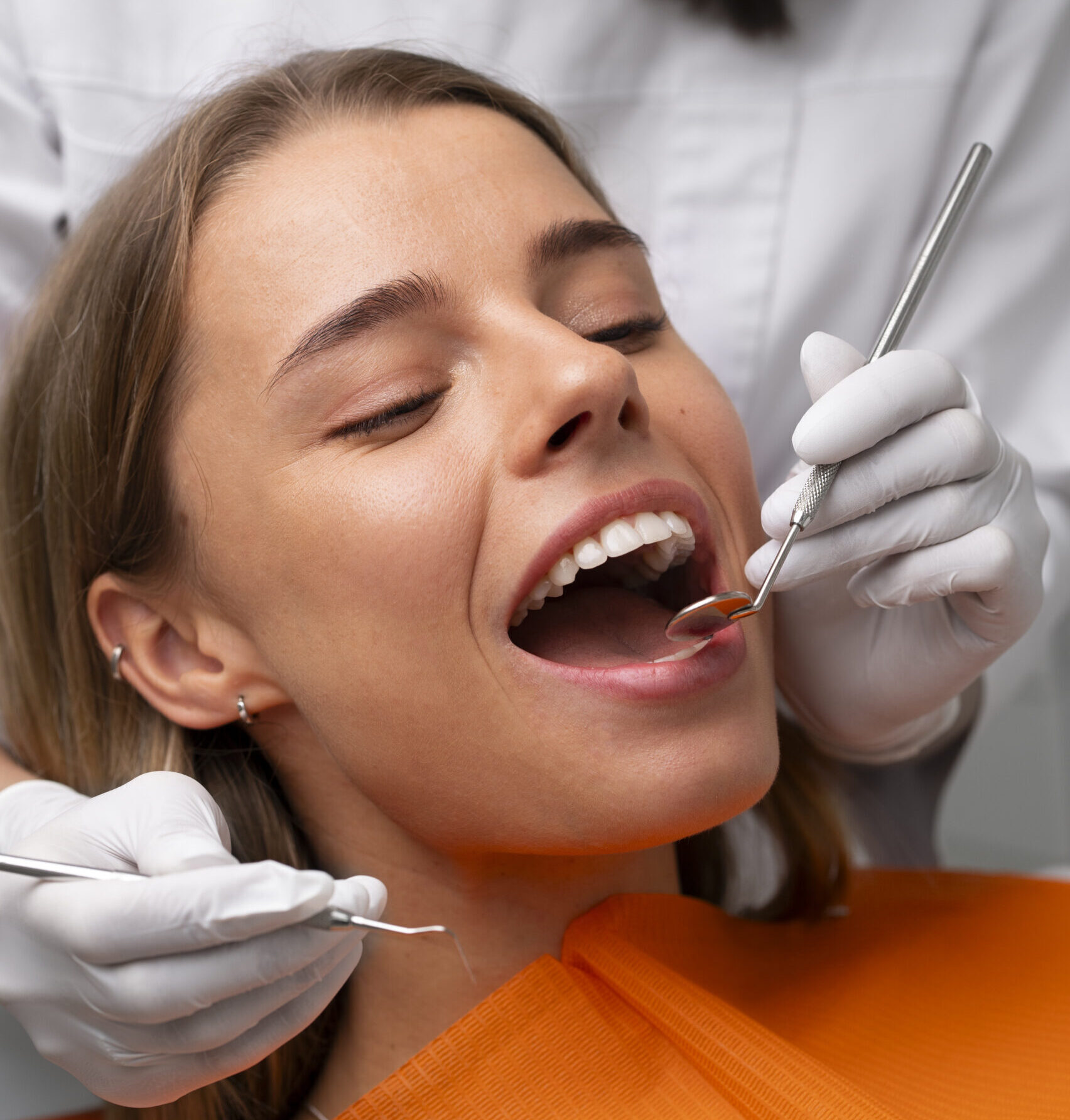 A woman receiving professional teeth cleaning at a dental clinic in Las Vegas