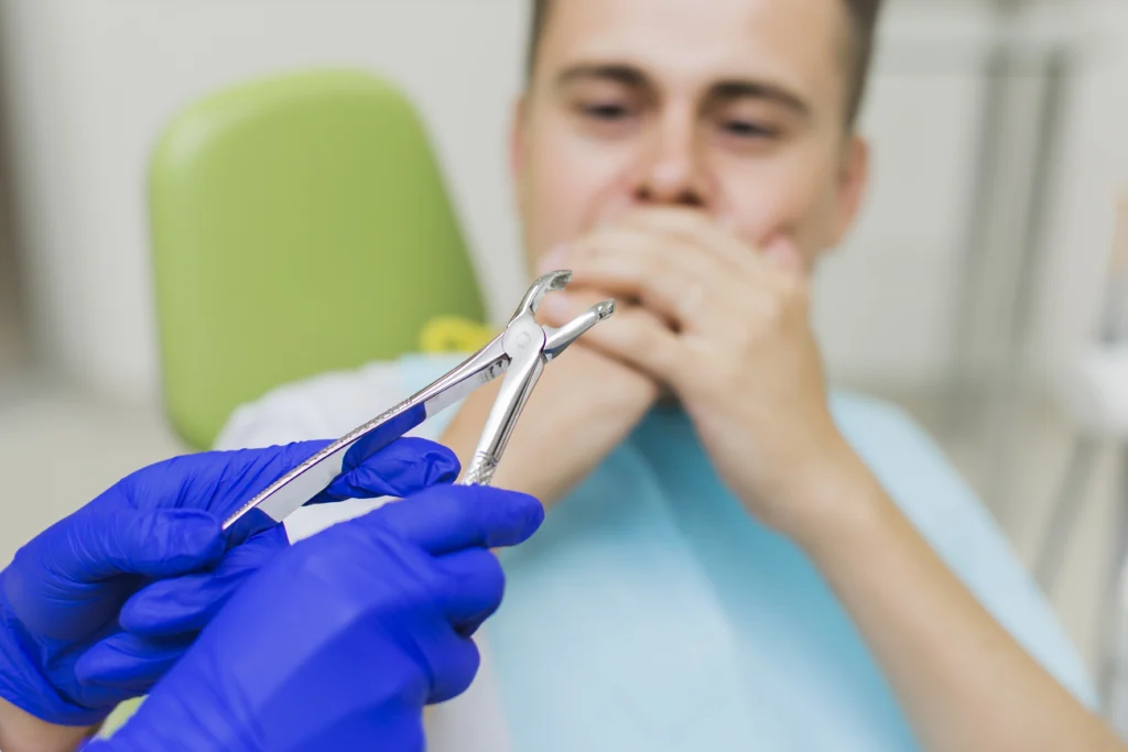 At Care for You Dental clinic, a dentist and a male patient are undergoing a tooth extraction process